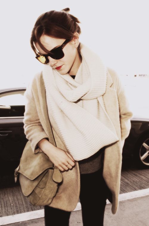 Emma Watson: minimal and classic // Love the cream scarf layered over the camel jacket.: 